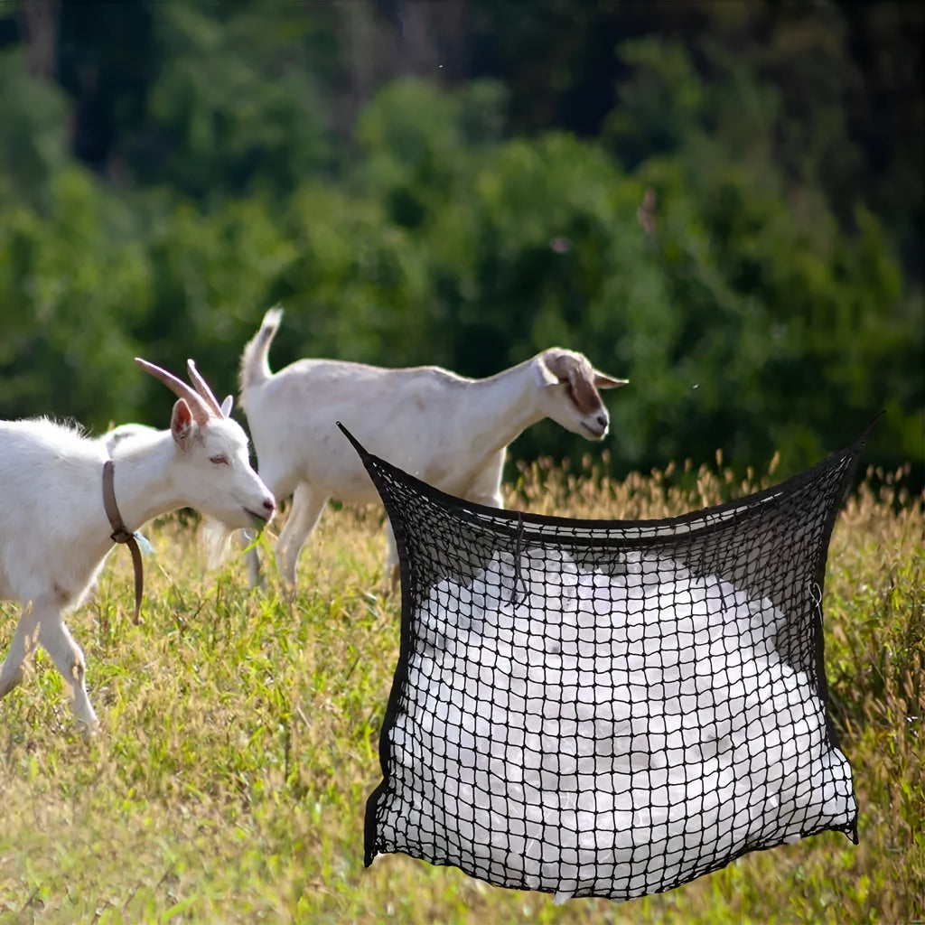 Black woven grid horse feeding bag hanging on a fence