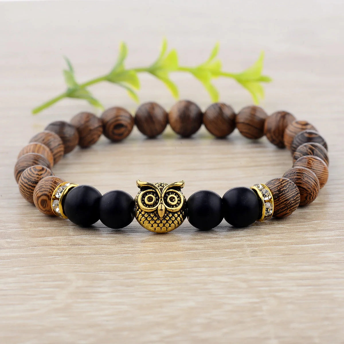 Owl frosted stone lifeline wood grain bracelet in black and gold, adjustable for a perfect fit