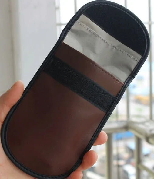Black microfiber Faraday cage pouch for blocking car key fob and mobile phone signals.