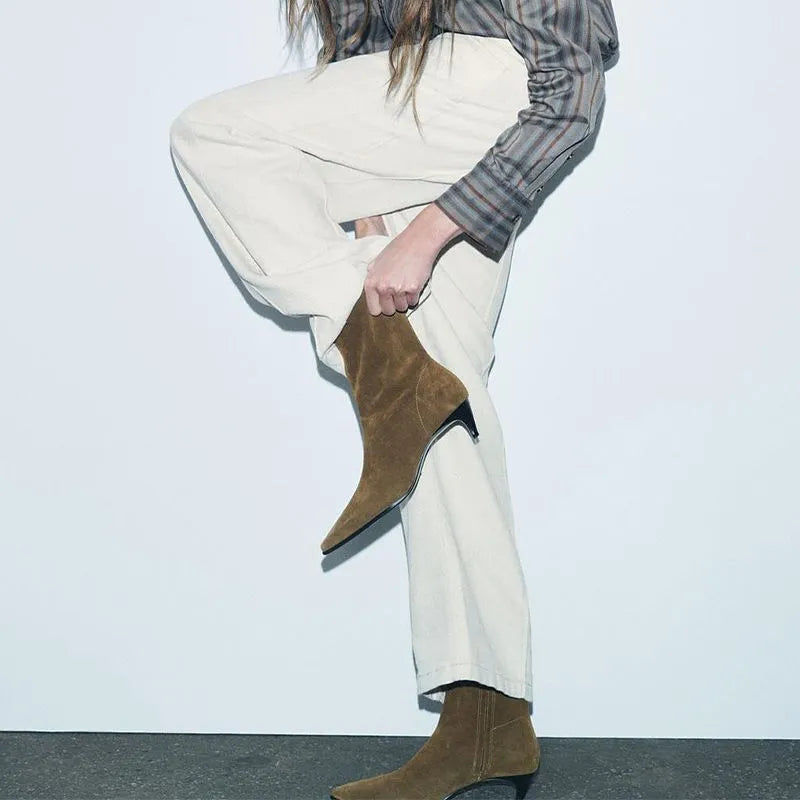 Brown women's square toe ankle boots with a side zipper and a mid-height stiletto heel on a waterproof platform sole.