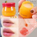 Honey pot lip balm with small brush applicator in pomegranate or blueberry flavour options