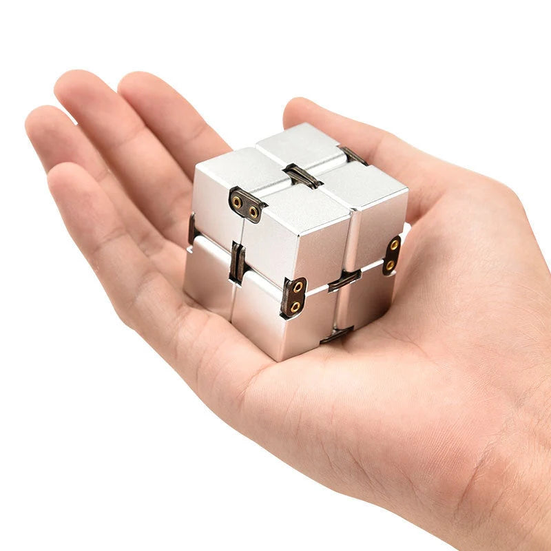 Infinity Cube Educational Toy in zinc alloy, available in multiple colours for focus enhancement and stress relief.