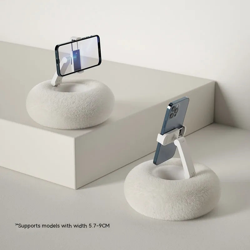 Adjustable rotating desk bracket holding a tablet, showing height extension and clamp mechanism.