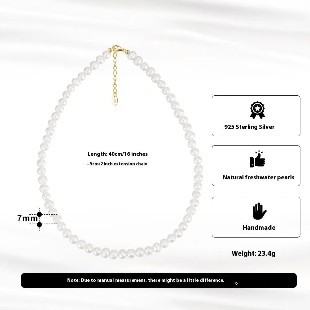 Women's silver adjustable chain necklace with a single natural freshwater pearl.