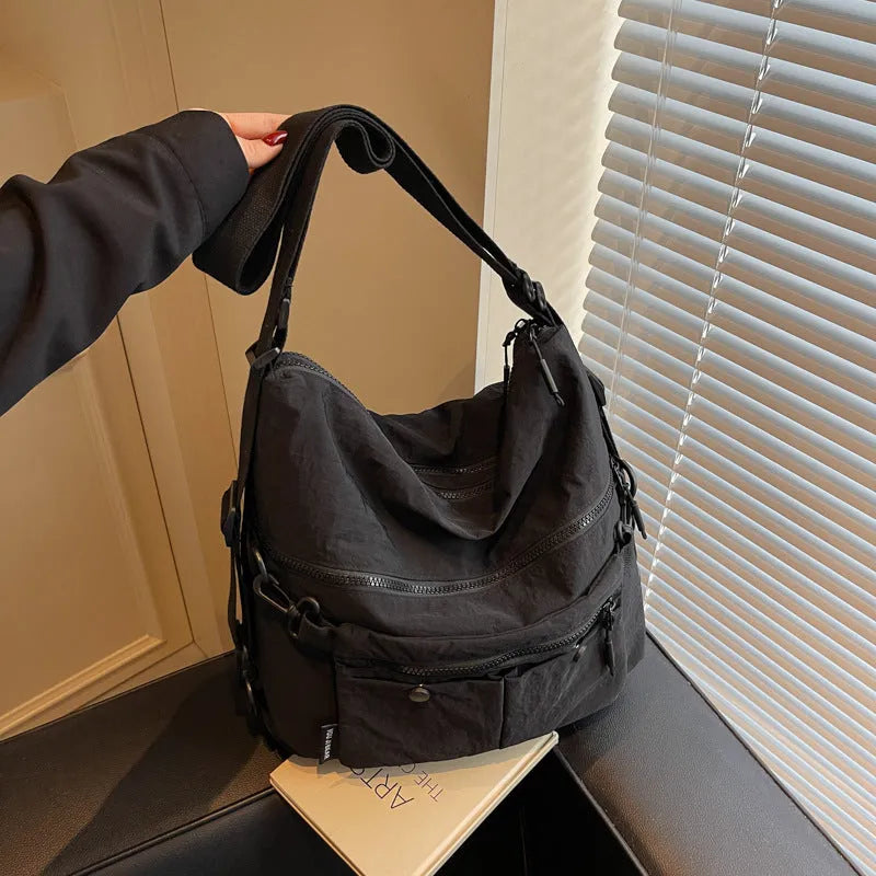 Women's nylon crossbody bag in square vertical shape with double shoulder straps and three-dimensional pockets