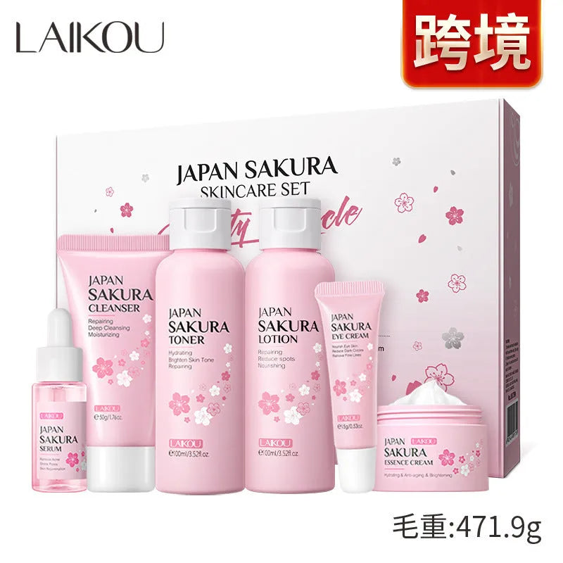 Boxed Cherry Blossom 6-piece skincare set showing cleanser, toner, creams, and serum.