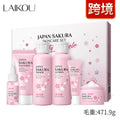 Boxed Cherry Blossom 6-piece skincare set showing cleanser, toner, creams, and serum.