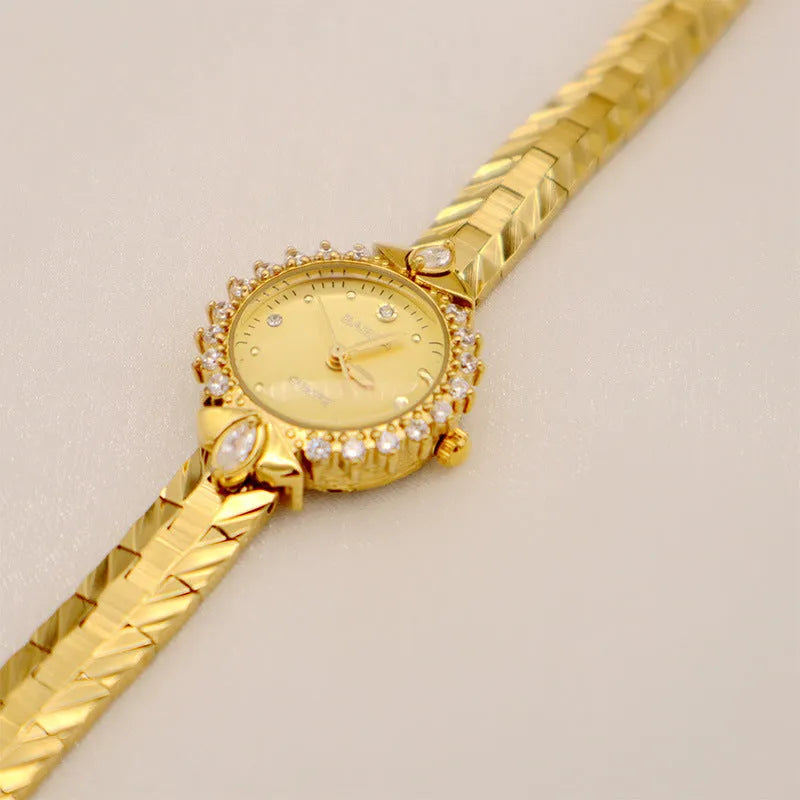 Women's vintage quartz bracelet watch with gold surface showing 6mm thickness and diamond embossed detail