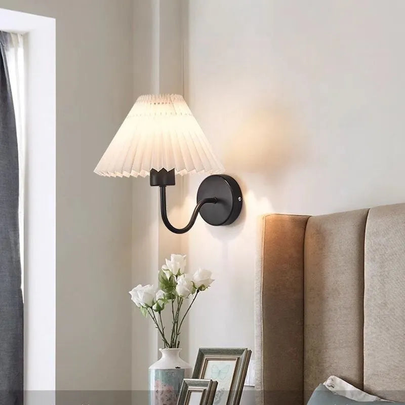 Retro LED wall lamp in iron finish with apricot colour option for bedside reading