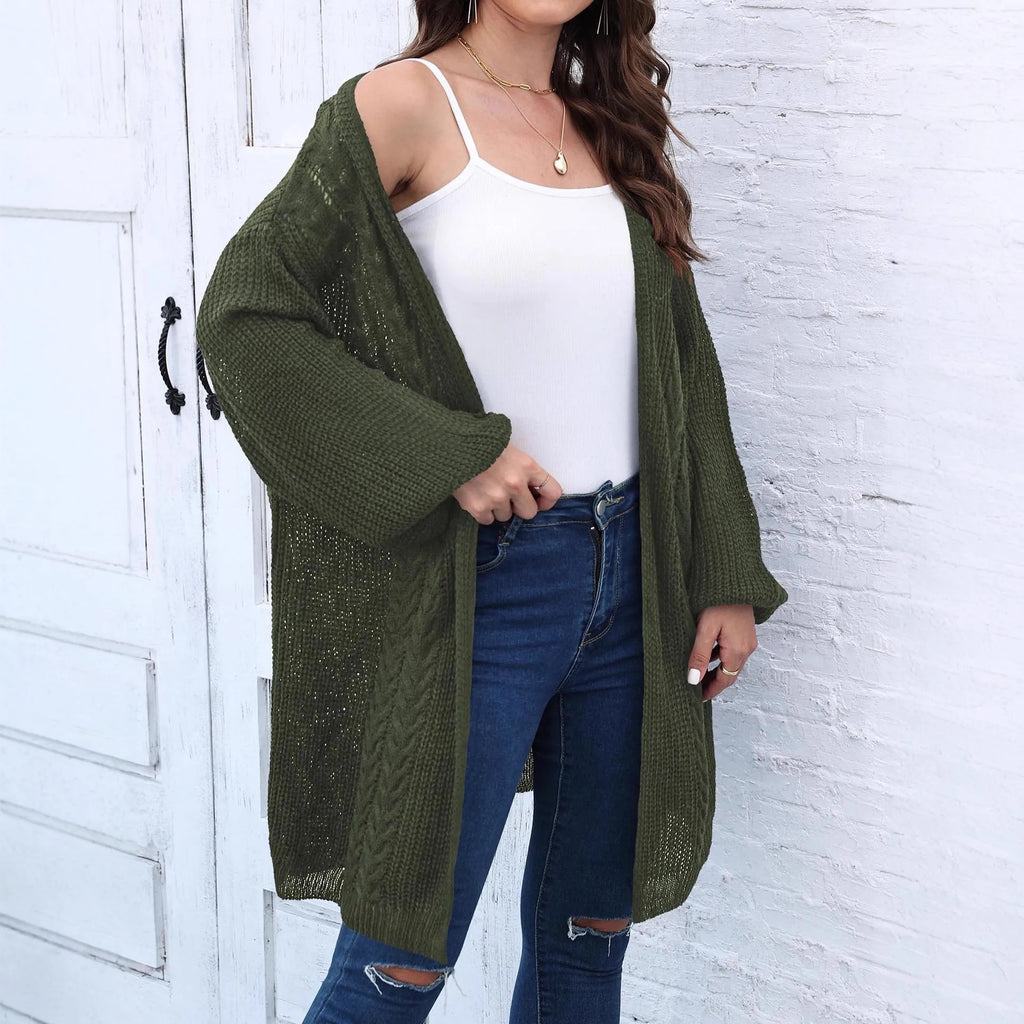Women's loose brown acrylic sweater coat showing front detail and casual fit.