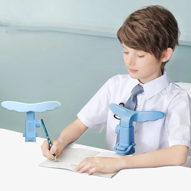 Student anti-myopia seated orthotics posture corrector with silicone chin support on a desk, blue frame