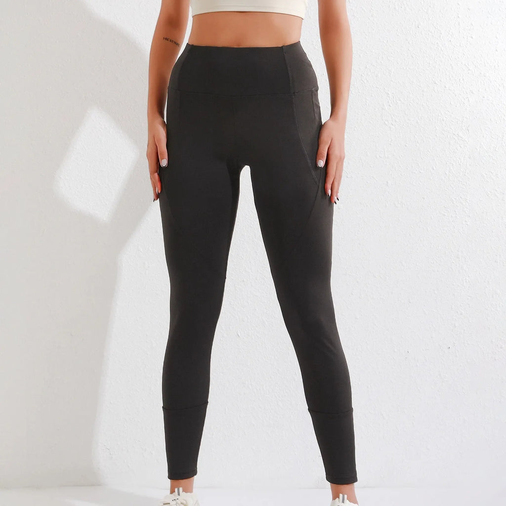 Black women's high waist elastic leggings with zipper pocket, cropped length, polyester spandex blend