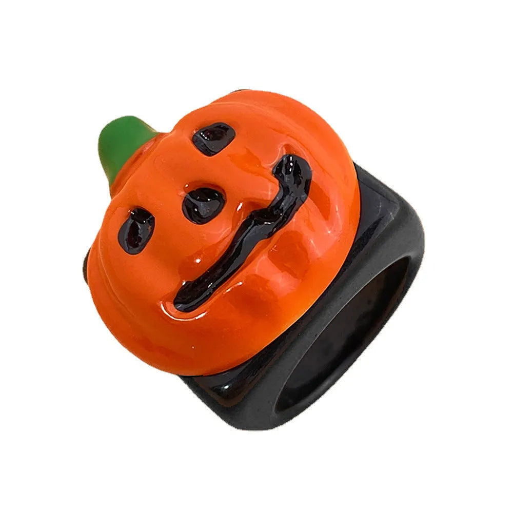 Halloween knuckle ring with epoxy finish and cartoon pumpkin bat ghost motifs in multiple colours