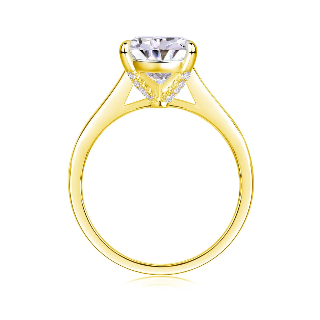Heart-shaped pear-cut moissanite wedding ring set in S925 silver with platinum plating on white background