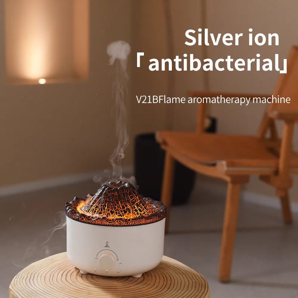 Small white volcano-shaped humidifier with simulated flame lighting and remote control