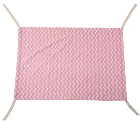 Portable crushed velour baby hammock attached to a crib, shown in pink colour.