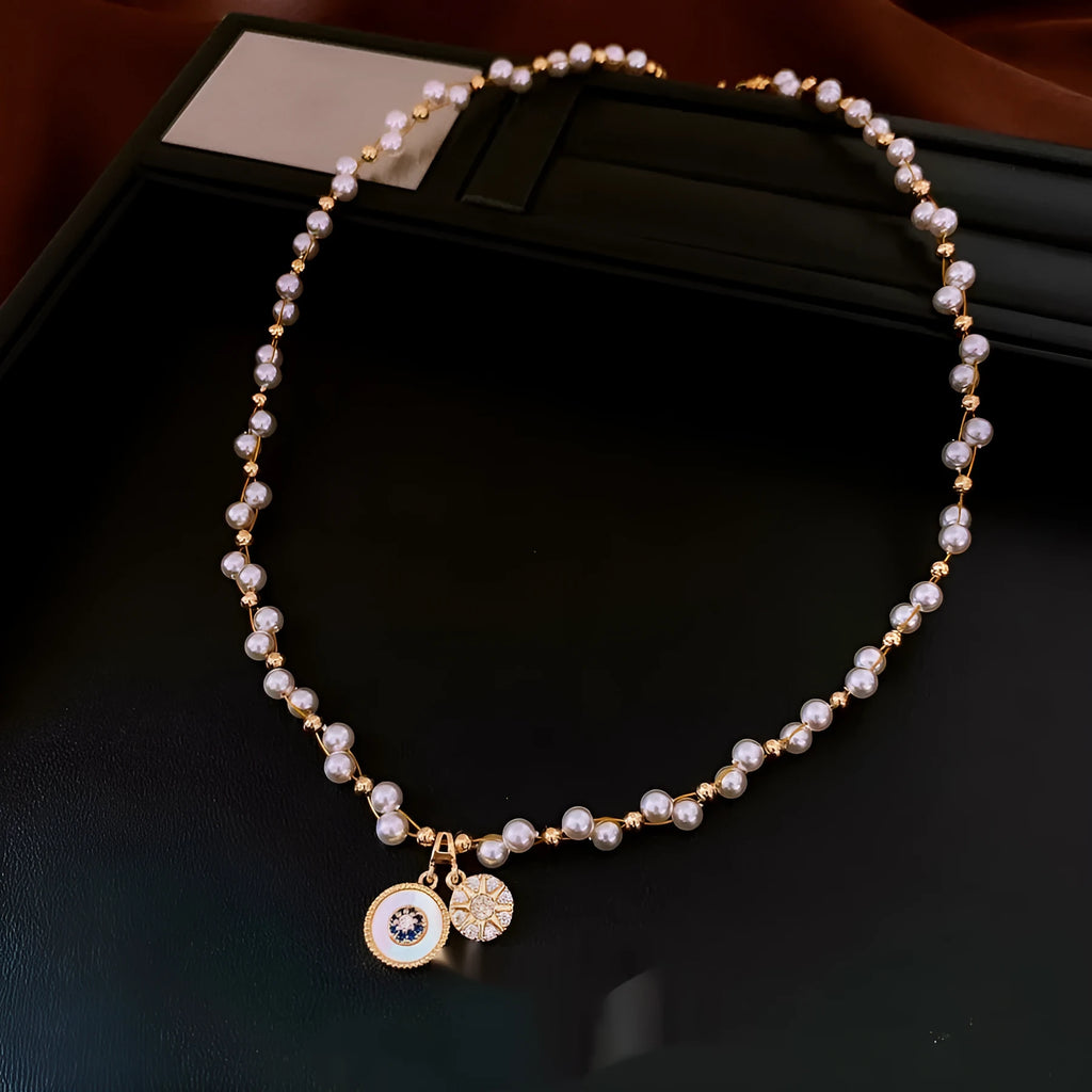 Gold electroplated necklace with white round pearl pendant on clavicle chain