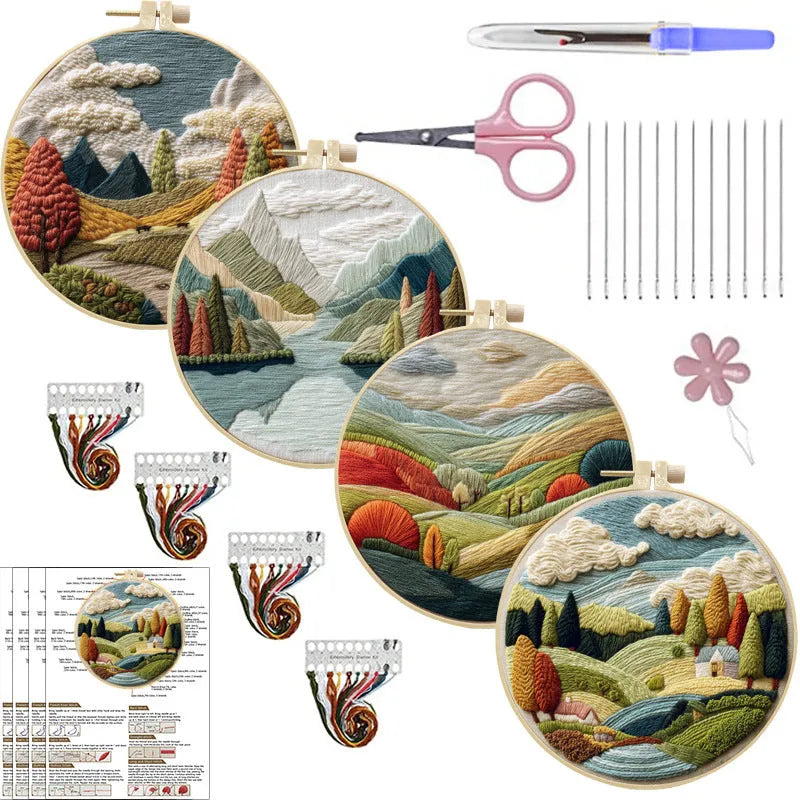 Complete DIY embroidery kit showing pre-printed landscape fabric, coloured threads, needles, and an embroidery frame.