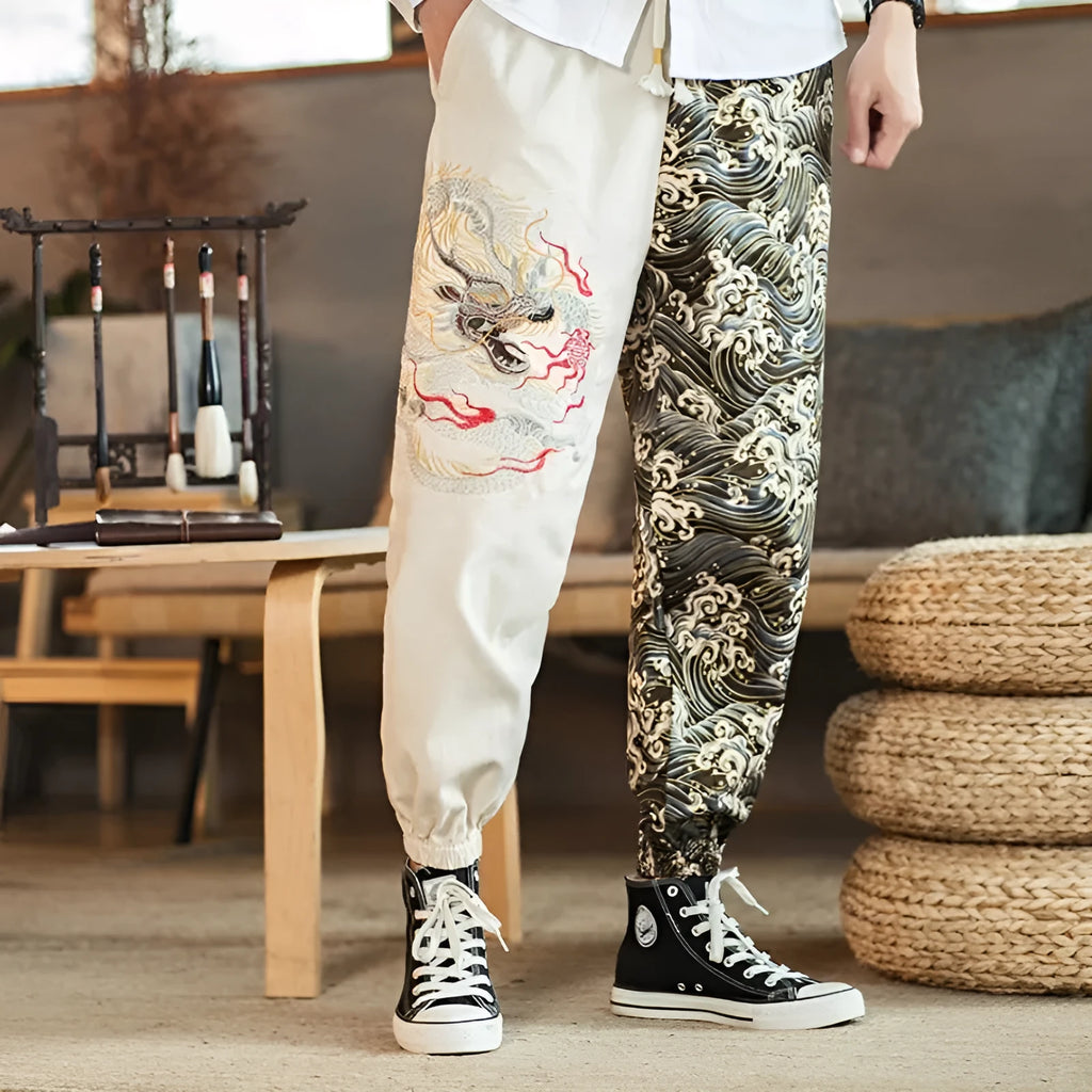 Embroidered silver dragon pattern on beige cotton casual trousers with mid-waist design