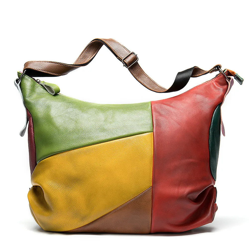 Brown cowhide leather crossbody travel bag showing front and side view