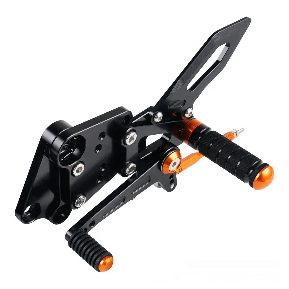 KTM DUKE motorcycle raised footrest relocation kit in black and orange colours