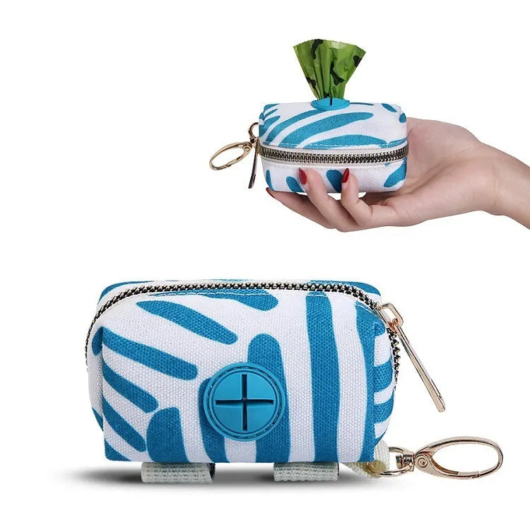 Compact polyester pet poop bag carrier with zipper closure and hand strap in forest bag print