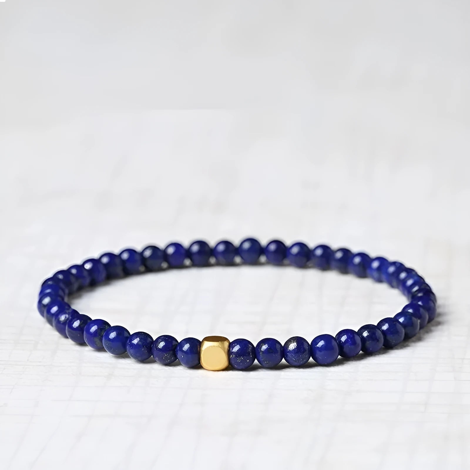 Natural crystal green and gold stone geometric bracelet with 16mm bead and electroplated finish.