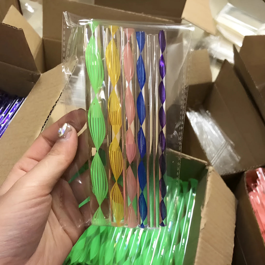 Pottery tool set containing acrylic ribs, stainless steel wire tools, and plastic sculpting tools inside a blue pen bag.