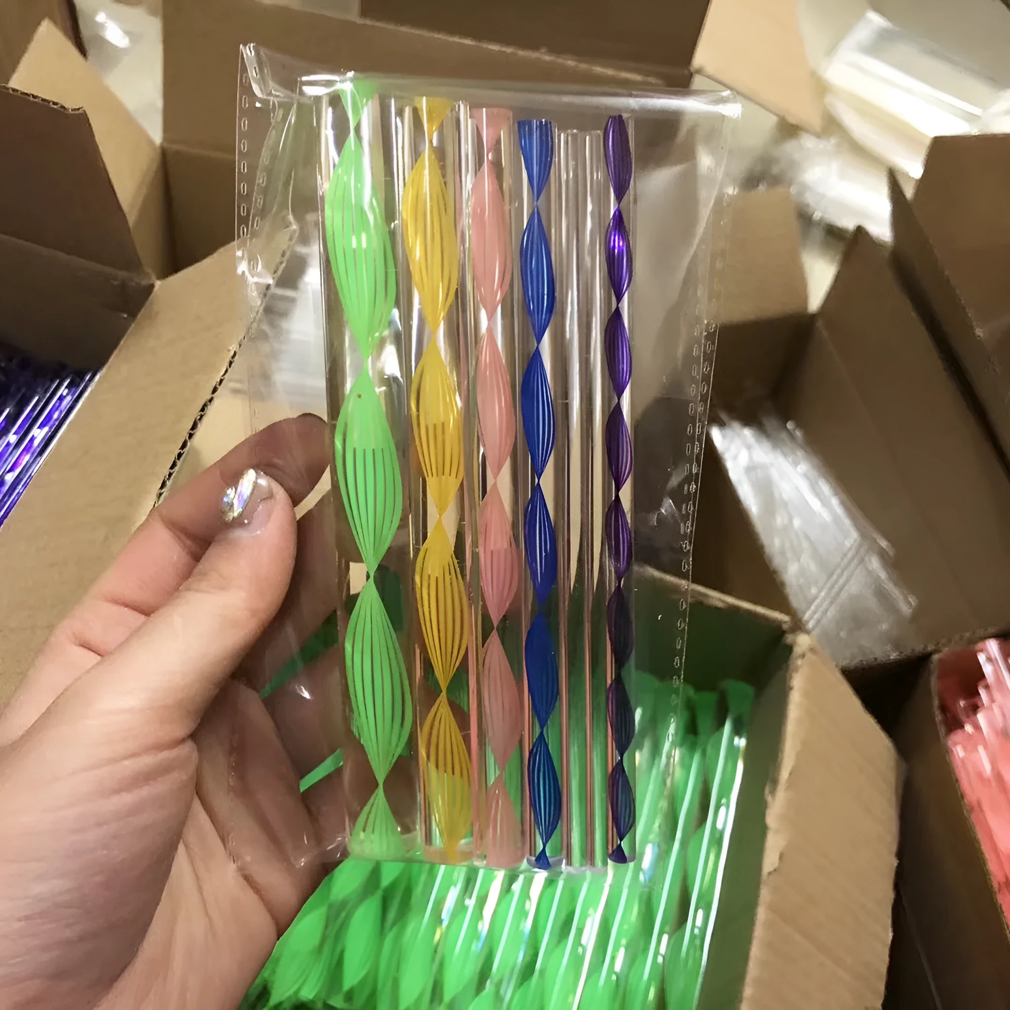 Pottery tool set containing acrylic ribs, stainless steel wire tools, and plastic sculpting tools inside a blue pen bag.