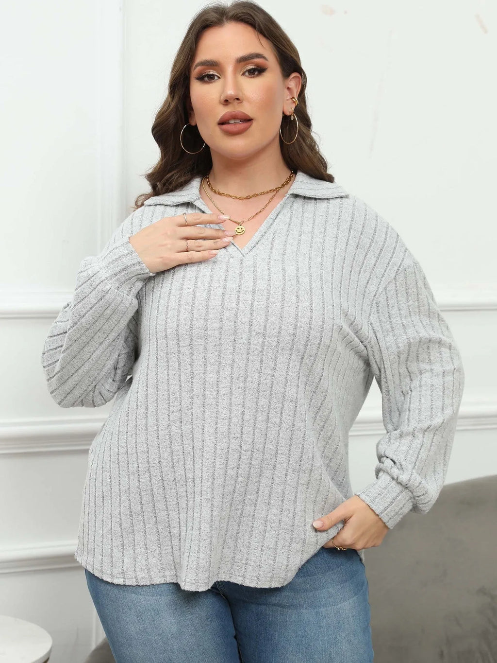 Women's plus size grey polo collar fleece pullover shirt with full lantern sleeves.