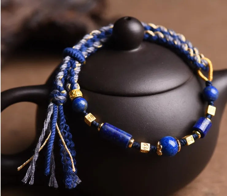 Close-up of a hand-woven flexible wire watch band in Lapis Lazuli blue colour.