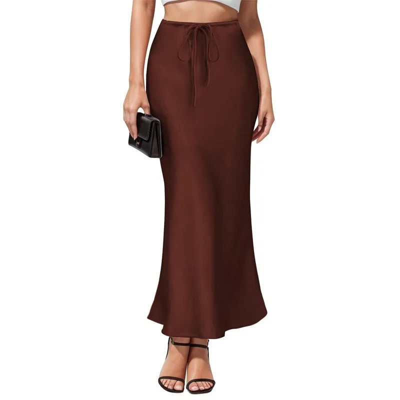 High-waisted asymmetric acetate satin skirt in a solid colour with irregular stitching detail.