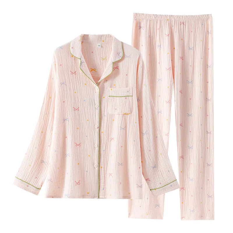 Beige and pink women's long-sleeved cotton pajama set with trousers on hanger.