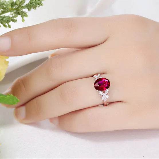 Women's butterfly ring with heart-shaped design and red or blue enamel options on rose gold plating