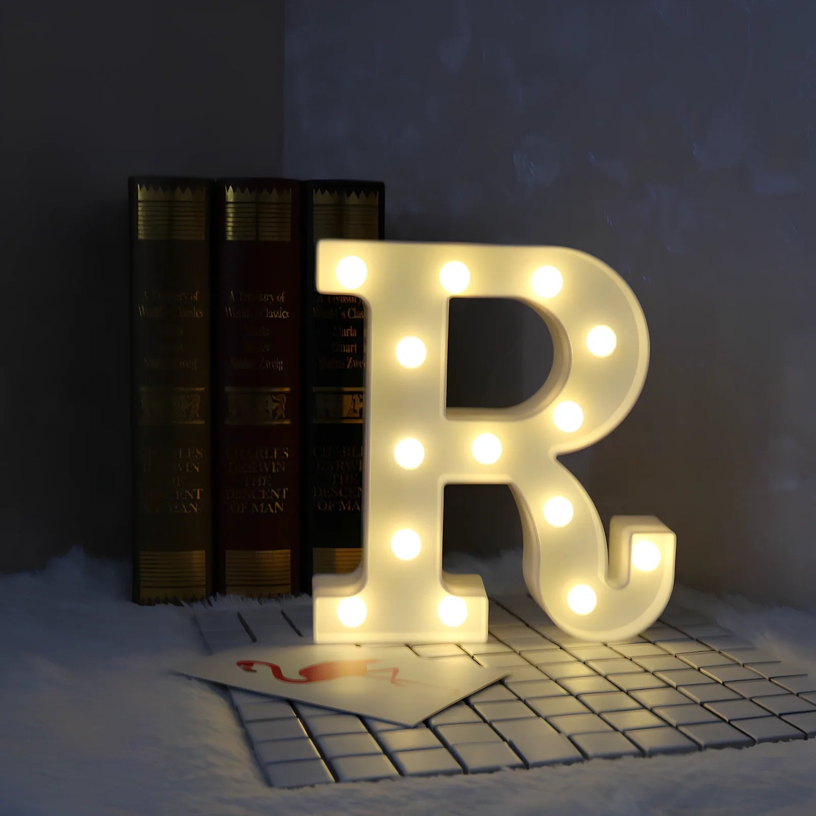White plastic LED alphabet marquee sign with warm white illumination, 22cm height with battery operation