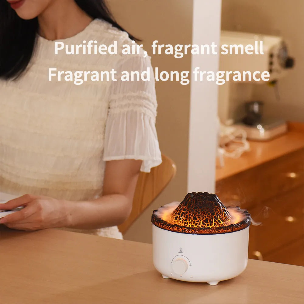 Small white volcano-shaped humidifier with simulated flame lighting and remote control