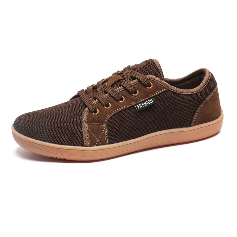 Men's low-top lace-up leisure sneaker with mesh upper, rubber sole, wide toe, flat heel, in black colour