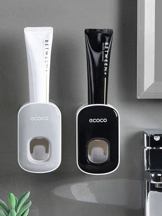 Wall-mounted automatic toothpaste dispenser with upside-down mouthwash cup for convenient and hygienic bathroom organization