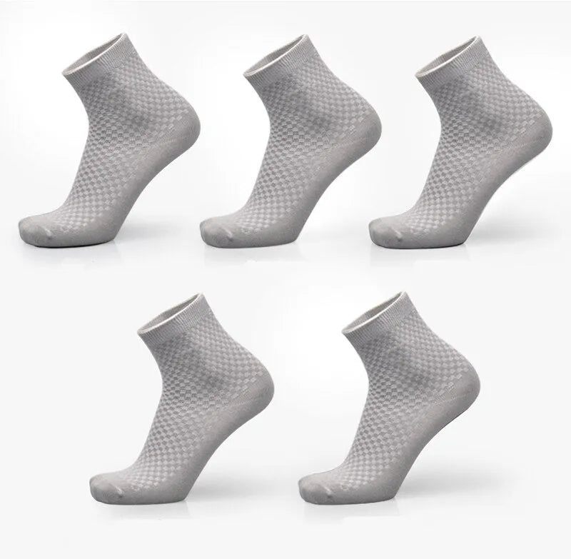 A pair of men's bamboo fibre ankle socks with a small square pattern, shown in one of the five available colours.