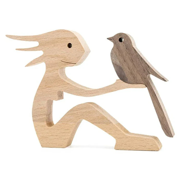 Handcrafted wooden dog sculpture featuring a man and his loyal canine companion