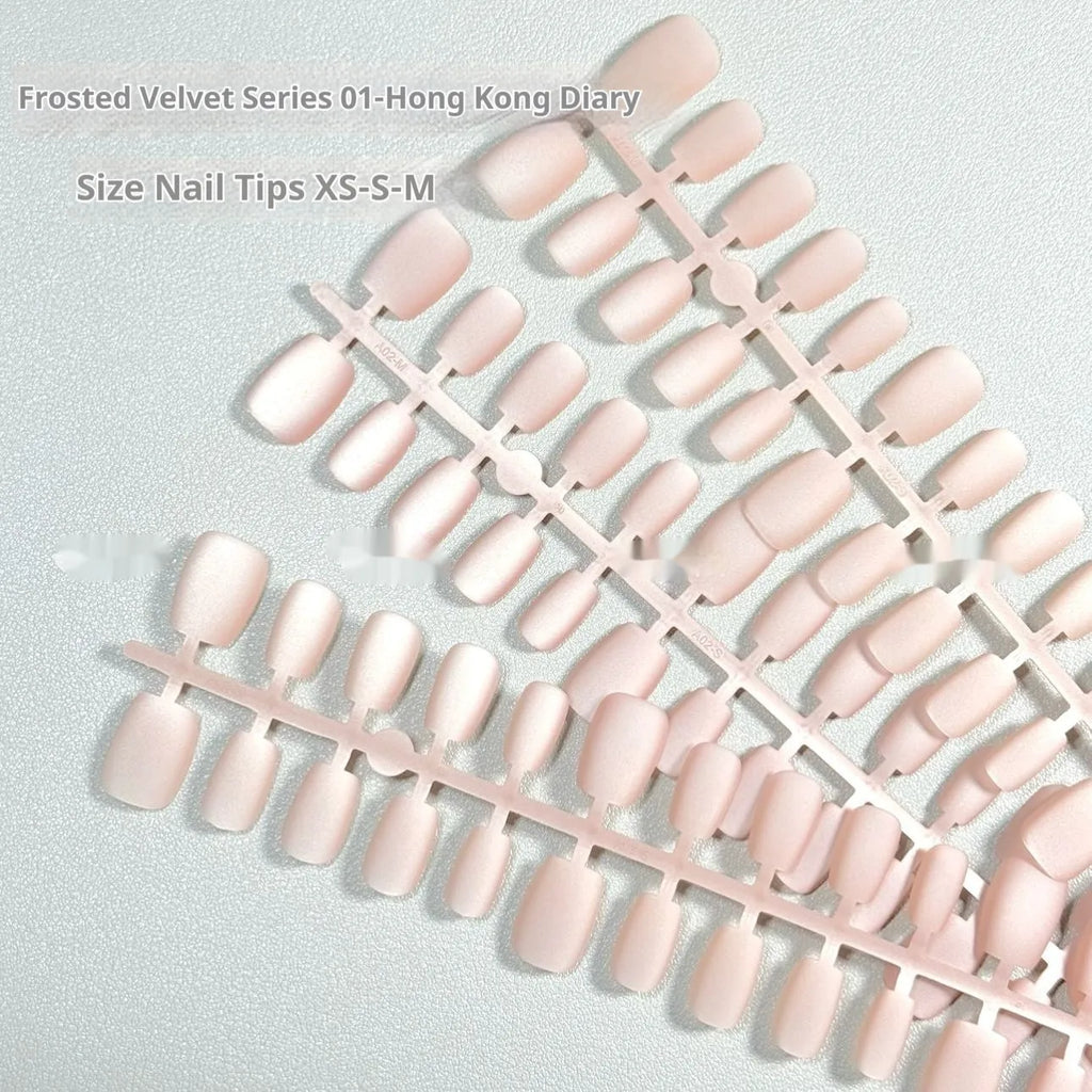 Frosted velvet cats eye effect aurora press on nail set in short ladder sizes XS, S, and M.