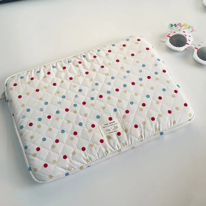 Women's polka dot polyester laptop bag shown in a solid colour, suitable for a 15.6 inch device.