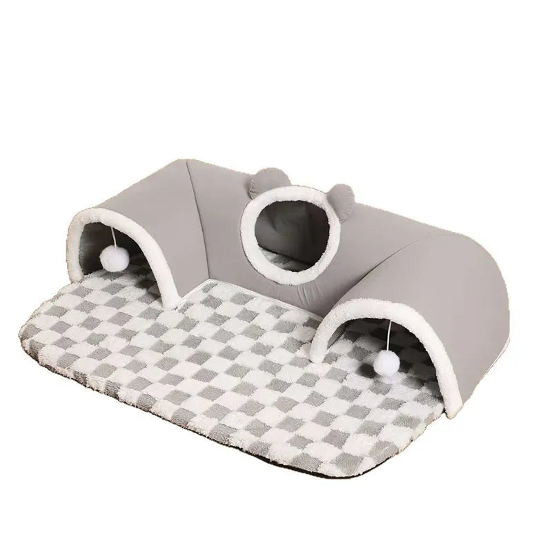 Cat tunnel bed in brown plaid fleece with hanging balls, semi-circular shape, slip-resistant bottom