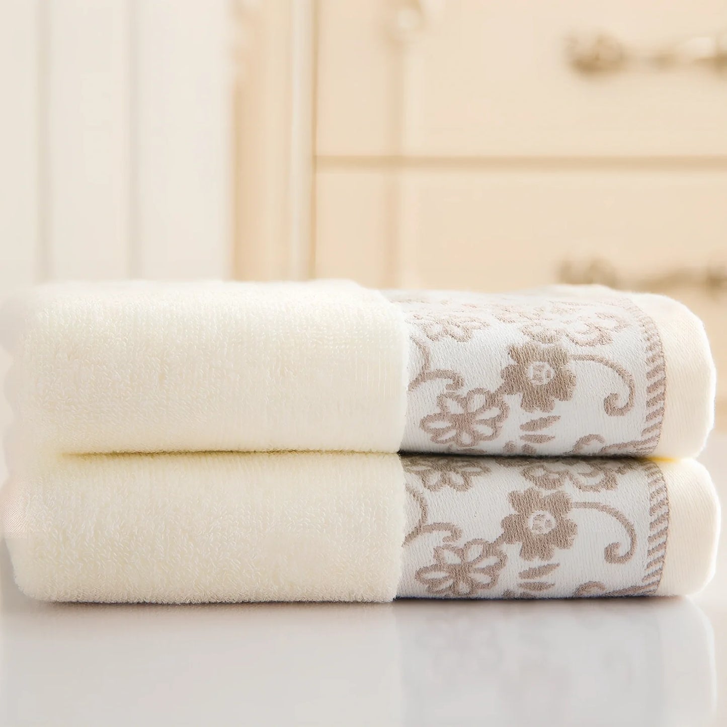 Creamy white wisteria flower jacquard cotton towel, 32 ply absorbent, 34x73cm dimensions