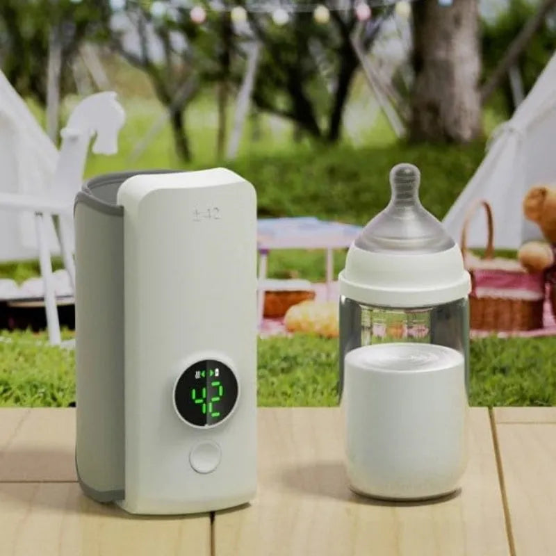 Portable USB-charged baby bottle warmer showing wrap-around design for universal bottle fitting