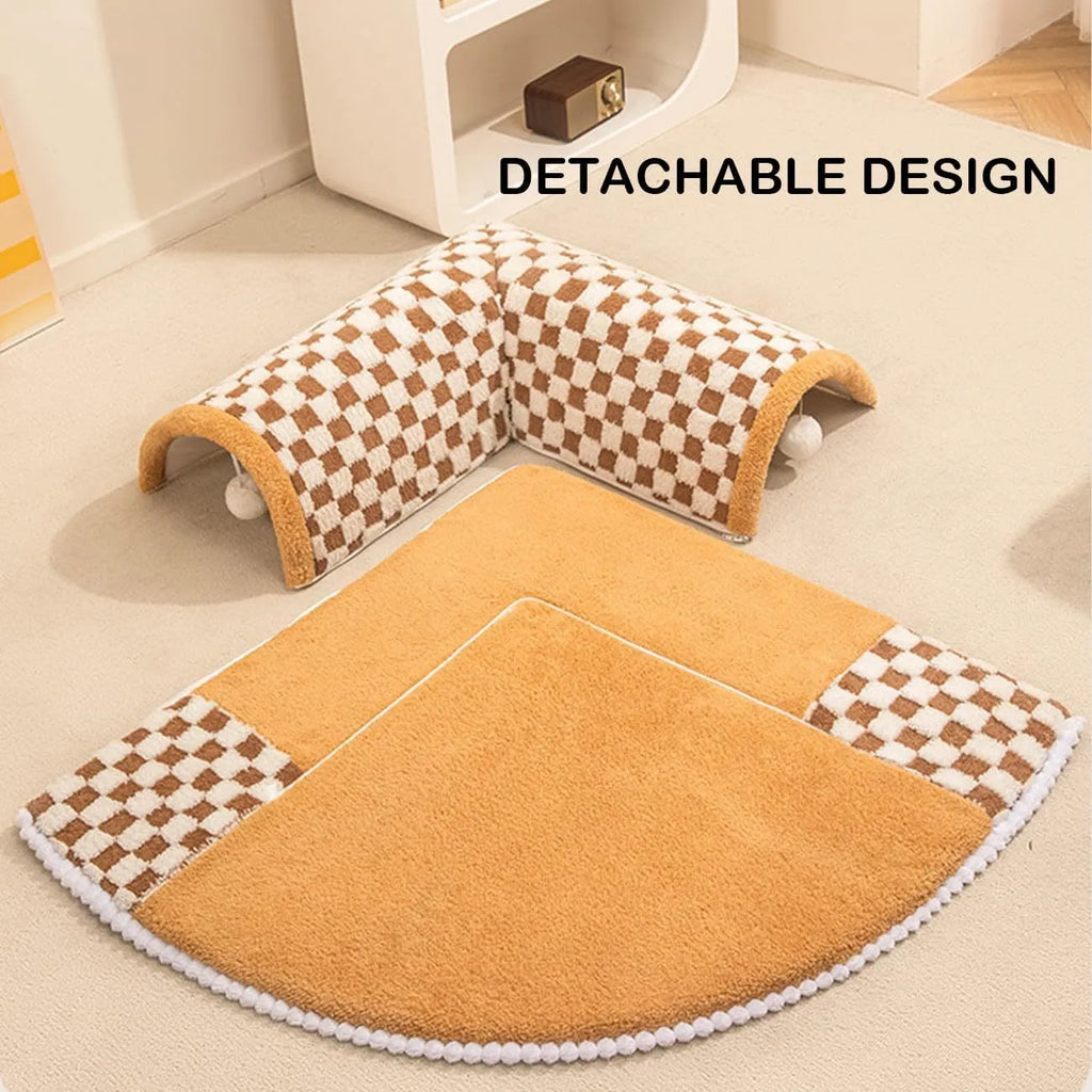 Large plush fan-shaped dog and cat bed with central tunnel, in coffee colour, on a floor.