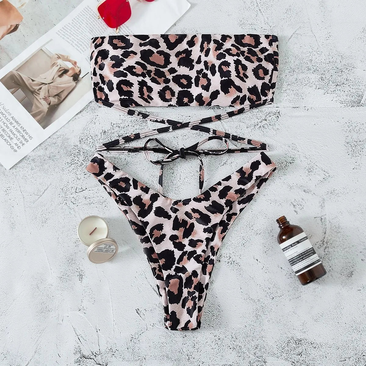 Leopard print bandeau split bikini swimsuit with removable chest pads on woman at beach