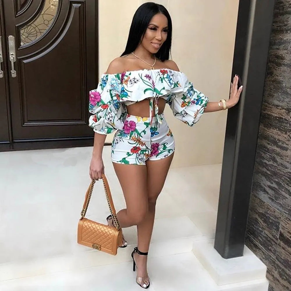 Women's multicolour digital print two-piece playsuit with fluffy pile sleeves and matching shorts.