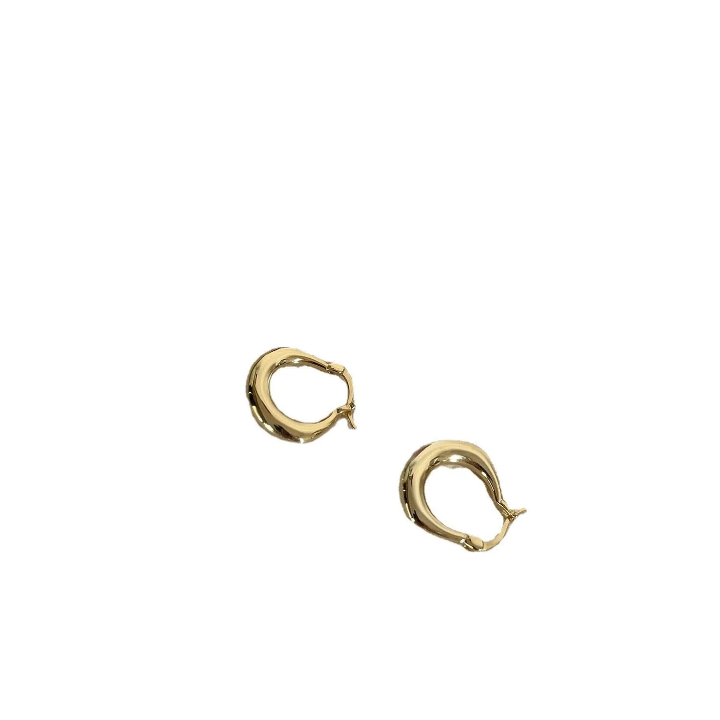Small fat circle ear clips in white gold and yellow gold finishes for women