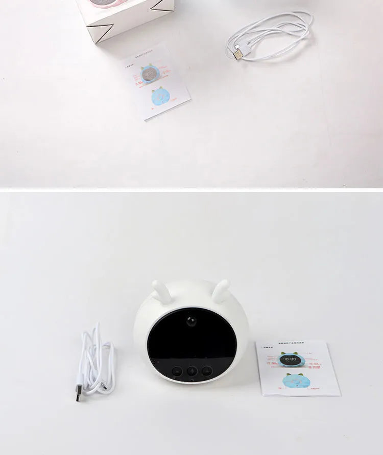 Smart alarm clock with voice control and human body sensor in silicone construction with luminous display